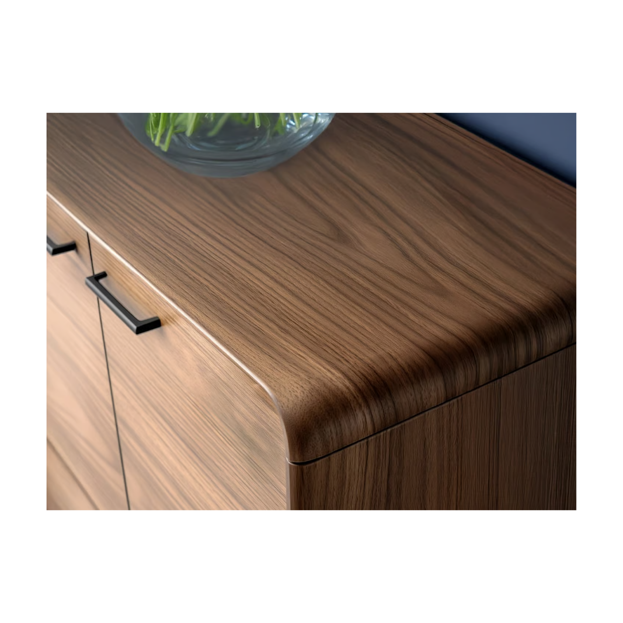 Close-up of a wood grain entry cabinet corner with smooth rounded edge and black metal handles.