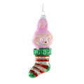 Glass ornament of a Labubu character with pink hair and striped stocking on a white background