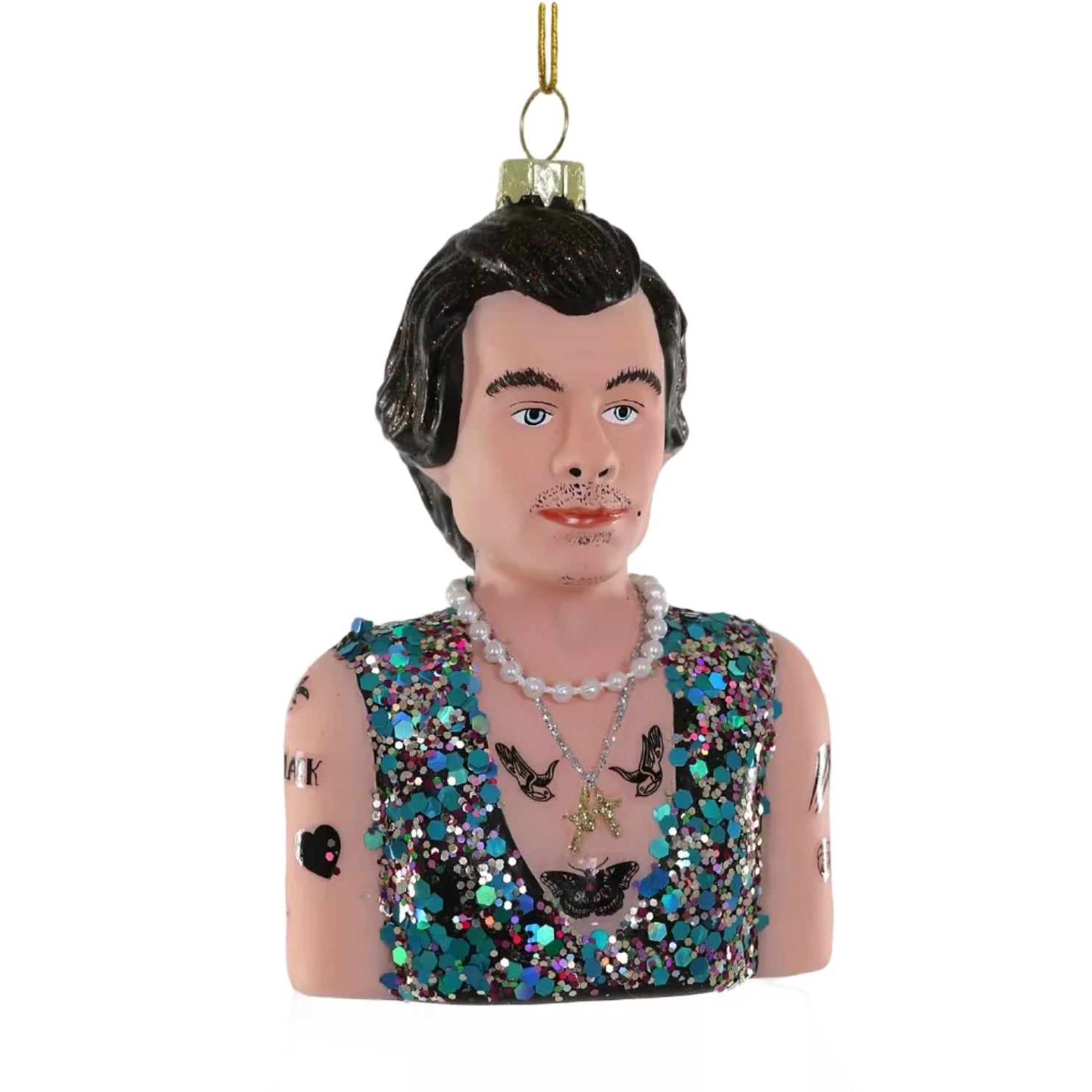 A Christmas tree ornament depicting a man's torso with short dark hair, a mustache, glittery shirt, tattoos, and layered necklaces.