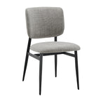 Modern dining chair with gray fabric upholstery and black metal legs, designed for comfort and style