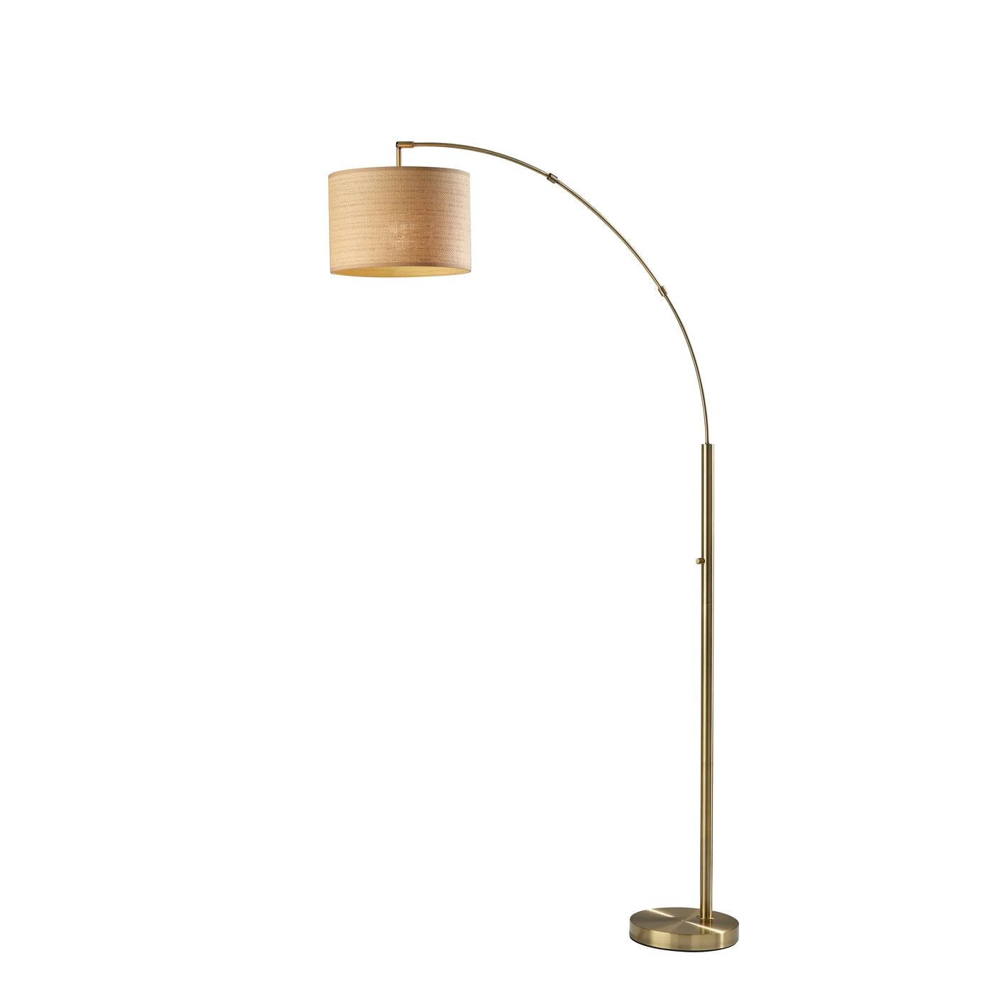 Modern arc floor lamp with a brass finish and a round beige fabric drum shade for home decor lighting.