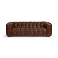 Brown tufted leather sofa with deep cushioning and rounded armrests in a modern design.
