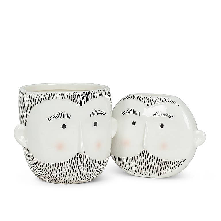 White ceramic planter with a minimalist bearded face design and soft blush cheeks, modern home decor accessory.