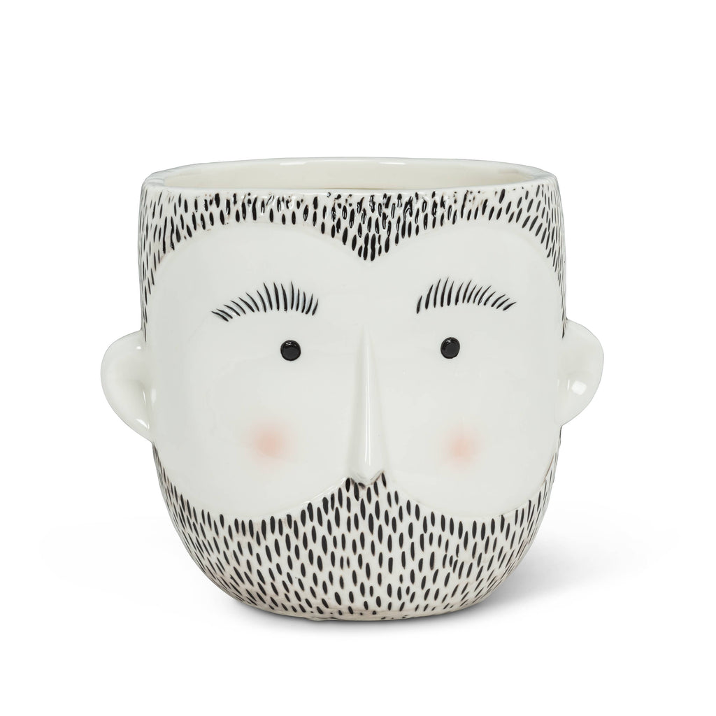 Ceramic planter shaped like a stylized male face with black beard and simple facial features for home decor.