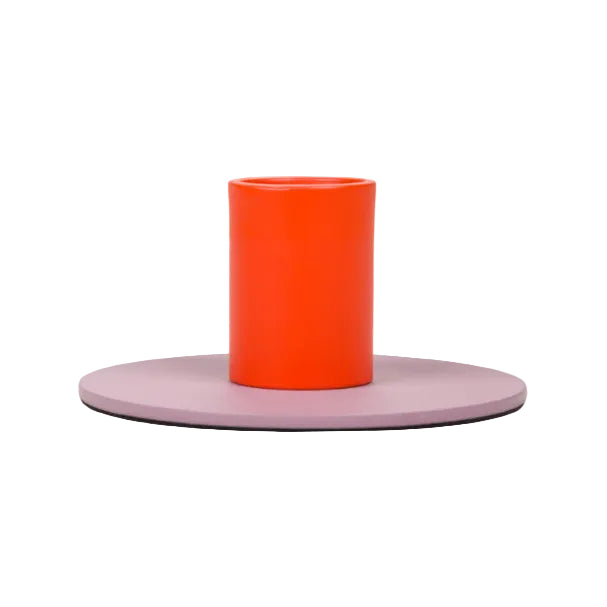 Modern two-tone metal candle holder featuring a vibrant orange cylindrical holder with a muted round base