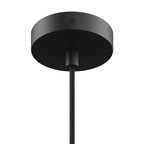 Close-up of a matte black ceiling mount and cord for a small modern pendant light fixture.