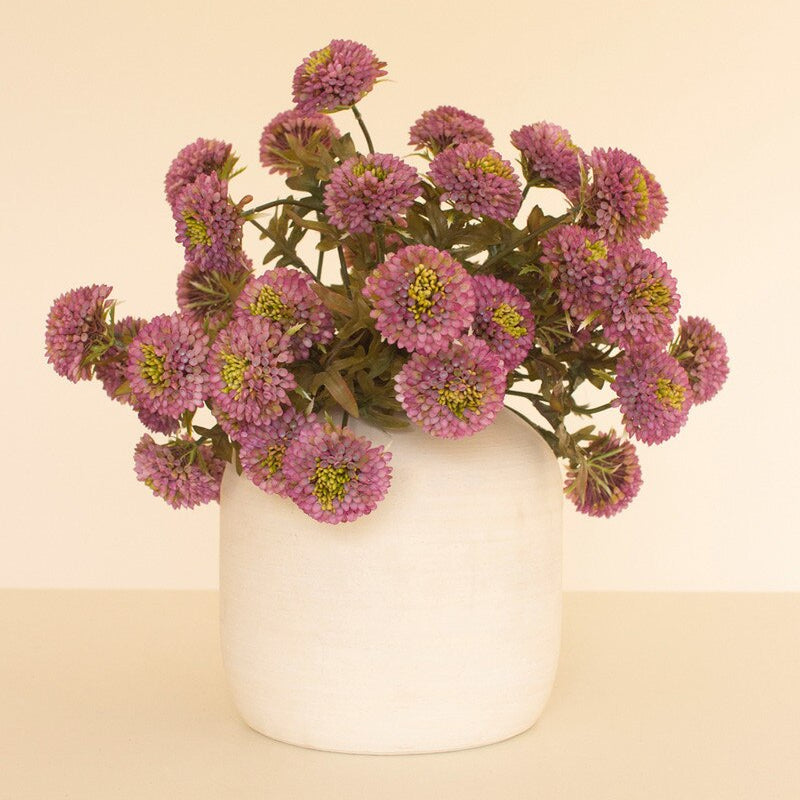 Artificial purple ball dahlias arranged in a white ceramic vase, ideal for home decor and floral accents.