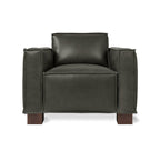 Contemporary black leather armchair with wide armrests and wooden block legs in a modern design