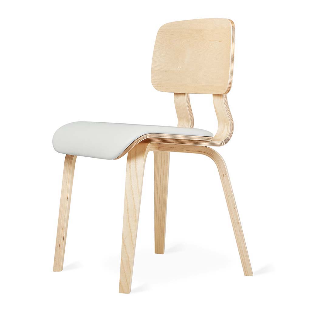 Modern dining chair with light wood frame and a smooth white cushioned seat and curved backrest