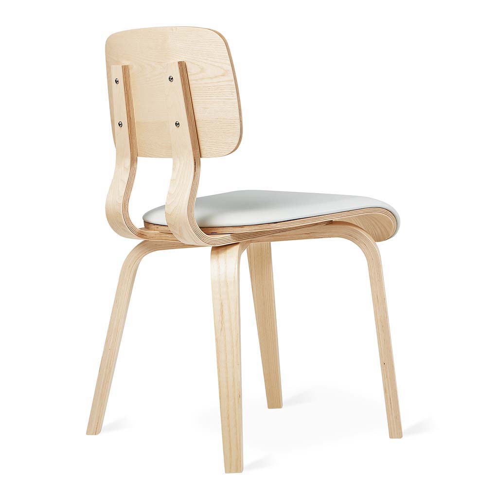 Side view of a mid-century modern wooden dining chair with a light-colored cushioned seat and curved backrest.