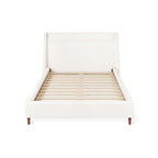 Minimalist upholstered bed frame with wooden slats and a high padded headboard in neutral fabric