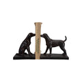 Black bookends shaped like dogs holding book on a white background