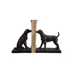 Black bookends shaped like dogs holding book on a white background