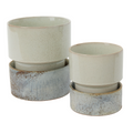ceramic planters featuring a speckled light beige glazed finish on the upper pots and a rustic, mottled blue-gray glazed finish on the lower pots, set against a plain white background.
