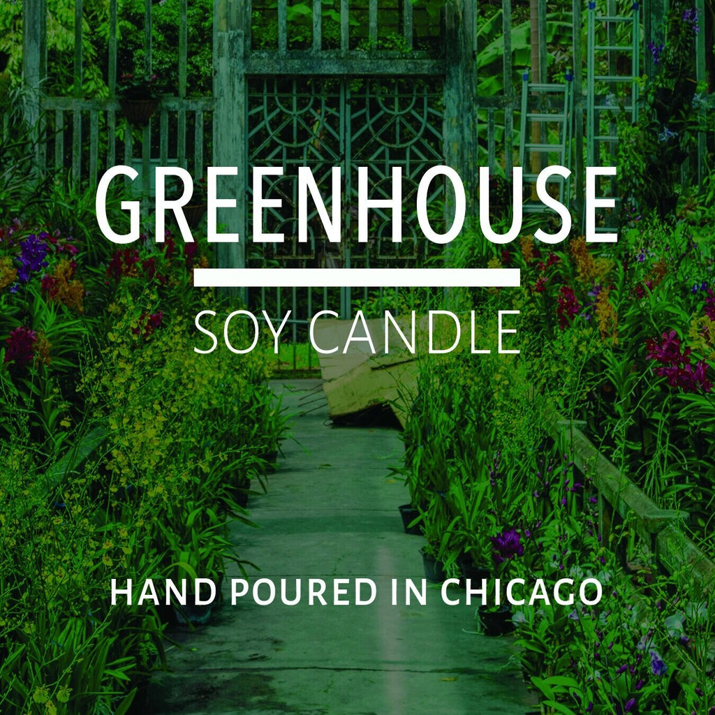 Lush greenhouse pathway filled with vibrant plants and flowers representing natural home decor inspiration.