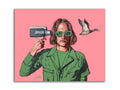 Man in green jacket and sunglasses holding vintage camera with flying duck on pink background
