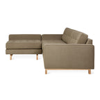 Modern bi-sectional sofa with tufted cushions and wooden legs in a neutral natural mocha fabric color