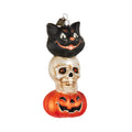Halloween ornament featuring a black cat, skull, and jack-o’-lantern stacked in a festive design