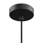 Close-up of a black ceiling mount and cord for a large pendant light fixture in modern home decor style