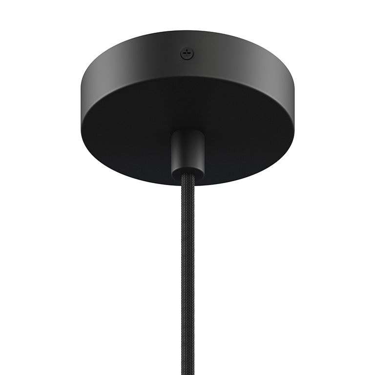 Close-up of a black ceiling mount and cord for a large pendant light fixture in modern home decor style