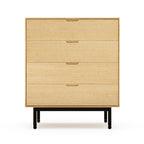 Light wood four-drawer dresser with black metal legs, featuring a minimalist midcentury modern design style.