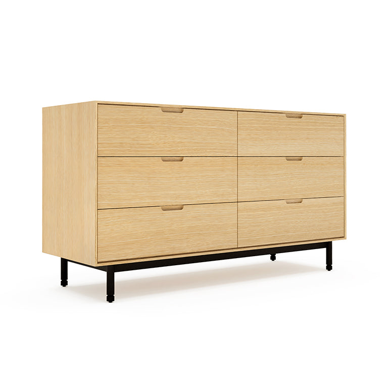 Six-drawer wooden dresser with a light oak finish and minimalist black metal legs in modern style