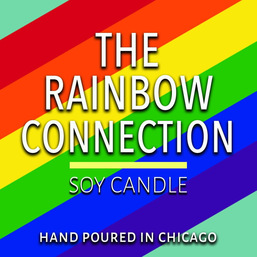 Colorful rainbow background with text about a soy candle hand poured in Chicago for home decor.