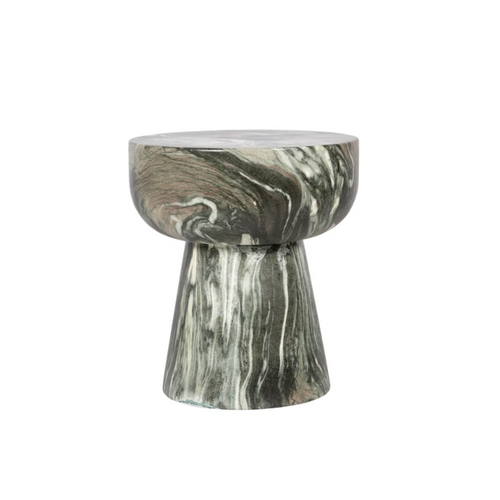 Modern sculptural side table with black and white marble swirl pattern and rounded top design