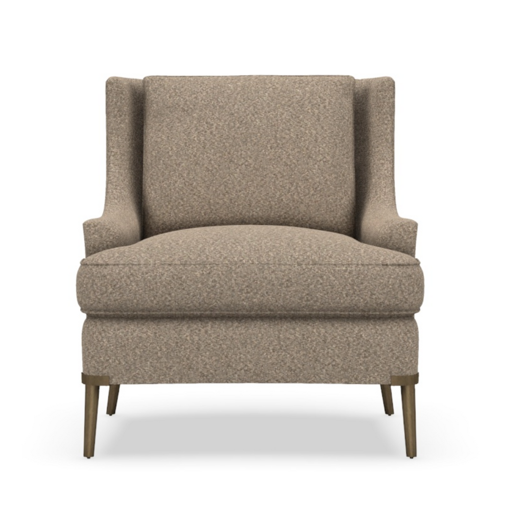 Modern beige upholstered chair with angled wooden legs and cushioned seat and backrest.