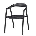 A modern black molded plastic dining chair with a curved backrest and four legs, shown from a three-quarter angle on a plain white background.