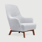 A modern high-back armchair upholstered in light gray heather fabric with tapered dark brown wooden legs, shown against a solid light gray background.