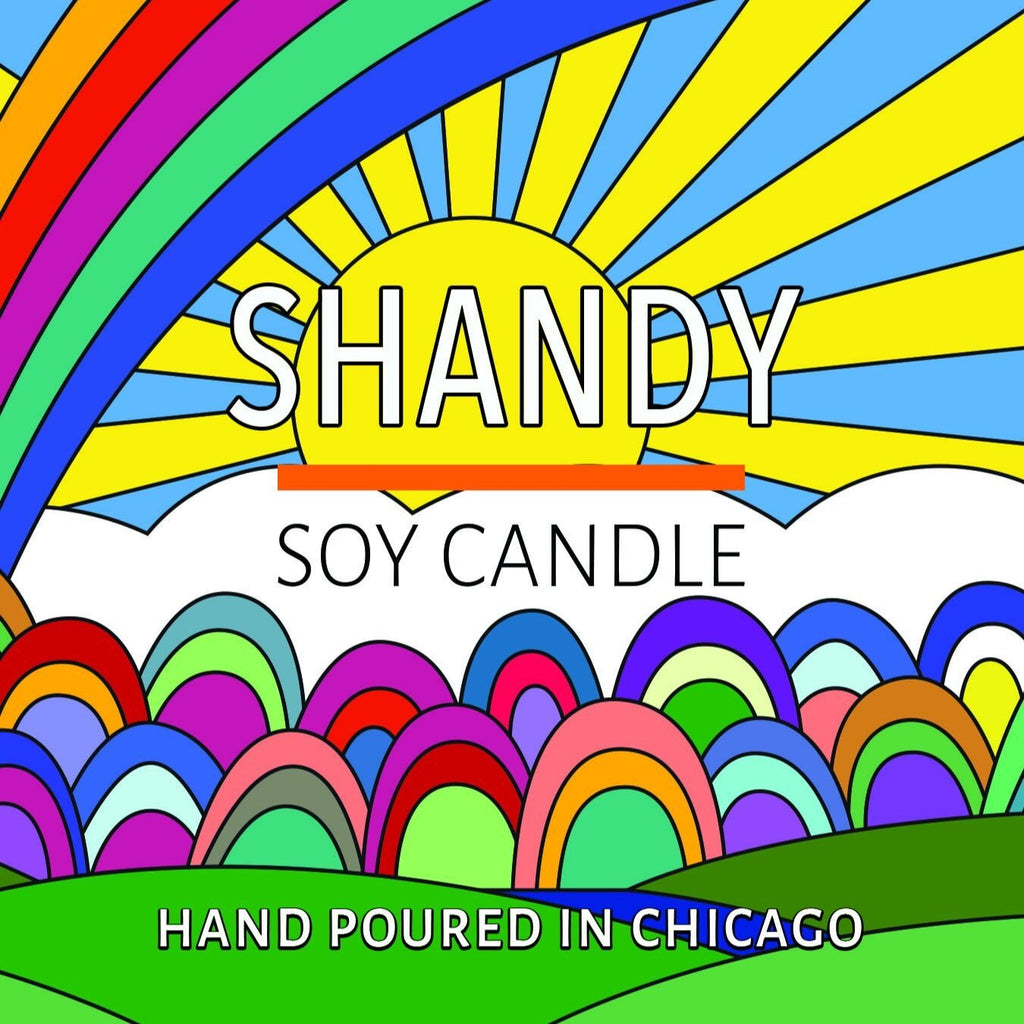Colorful illustrated label with a rainbow, sunburst, and text promoting a handmade soy candle from Chicago