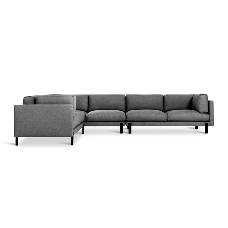 Gray fabric sectional sofa with modern low-profile design and black metal legs against a white background