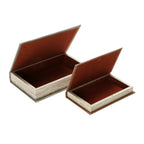 Two decorative book-shaped storage boxes with opened lids and fabric-lined interiors