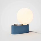 Compact modern lamp with a blue base and a glowing white spherical LED light, featuring a dimmer knob.