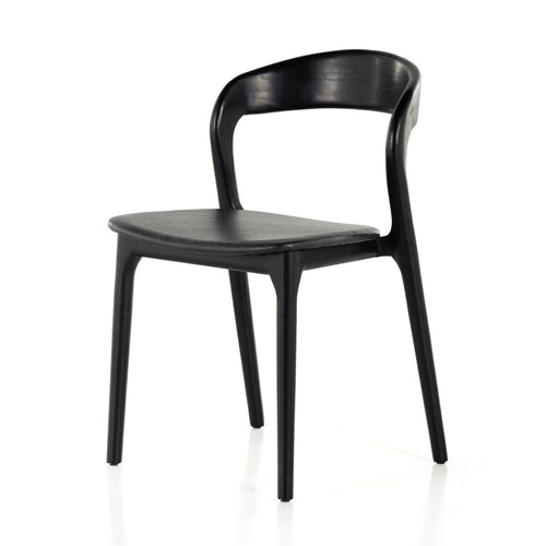 Black wooden dining chair with curved backrest and minimalist modern design on white background