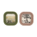 Two square decorative plates with beaded edges on a white background