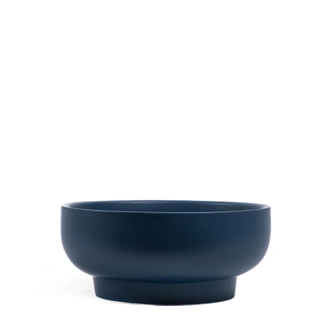 Midnight blue ceramic bowl on a white background
