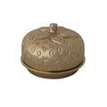 Decorative metal container with strawberry design on a white background