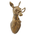 Gold-tone wall-mounted deer head sculpture wearing oversized glasses and a decorative scarf detail