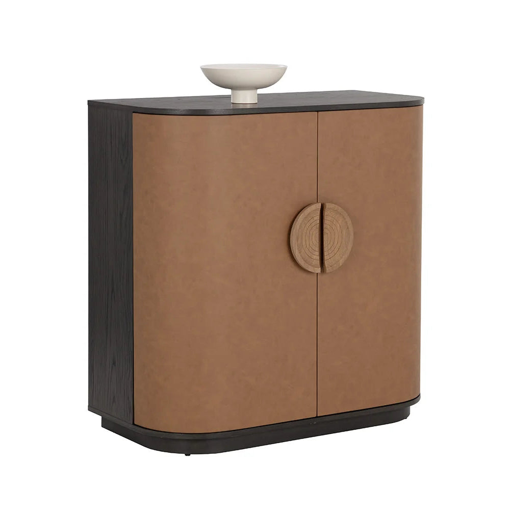 Brown cabinet with black top and white bowl on a white background