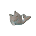 A small fish-shaped decorative object with a distressed metallic finish, featuring a mix of muted teal-blue and warm bronze-brown tones, isolated on a white background.