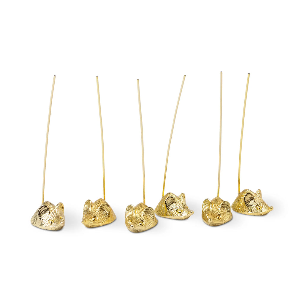 Set of six mice gold picks holders for hors d'oeurves on a white background