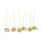 Set of six mice gold picks holders for hors d'oeurves on a white background