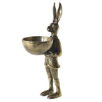 Bronze-colored hare figurine holding a small round bowl, detailed with textured clothing and upright ears.