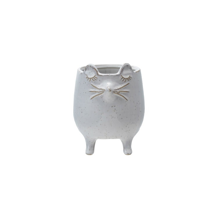 White ceramic planter shaped like a cute mouse with closed eyes and standing on four legs for home decor