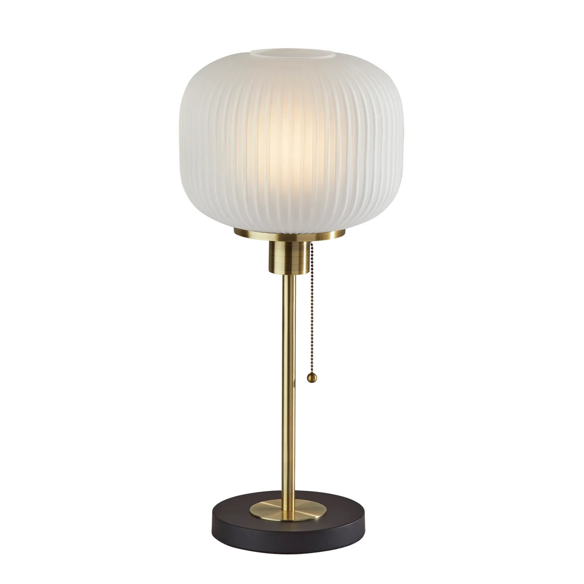 Modern table lamp with frosted ribbed glass shade, brass stem, and dark round base with pull chain switch