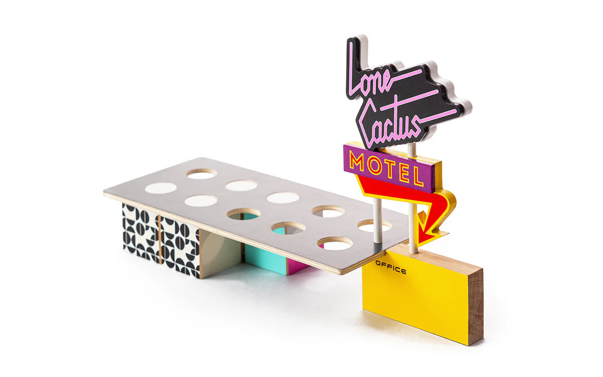 Wooden midcentury modern style motel toy with colorful retro sign and geometric patterns on base