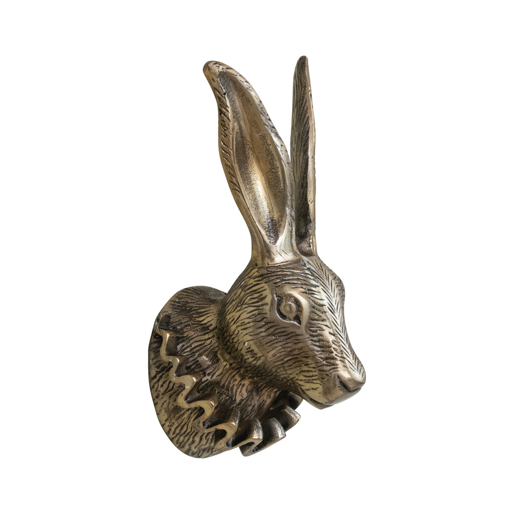Bronze hare head sculpture on a white background