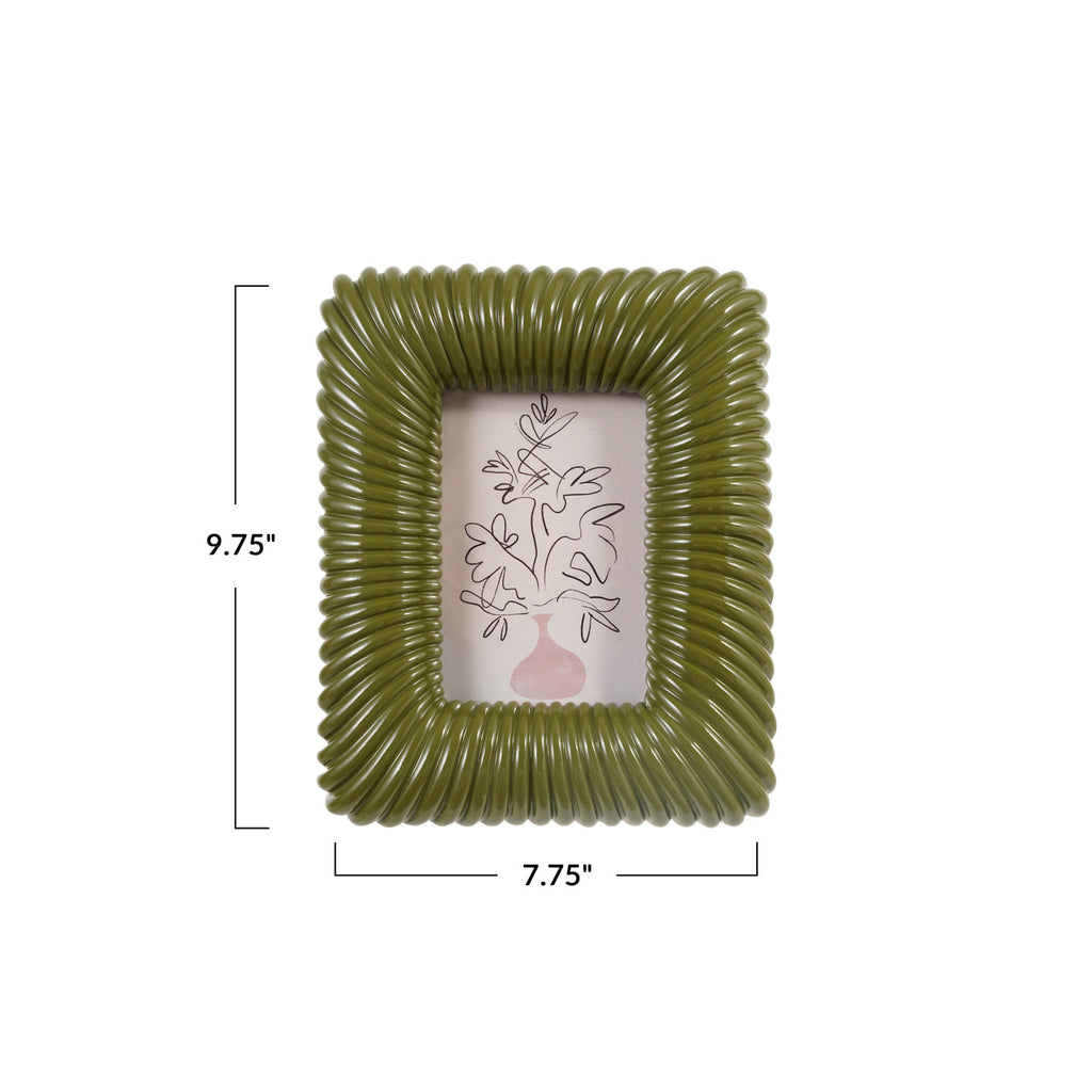 An olive green ribbed square picture frame with dimension markings showing 9.75 inches tall by 7.